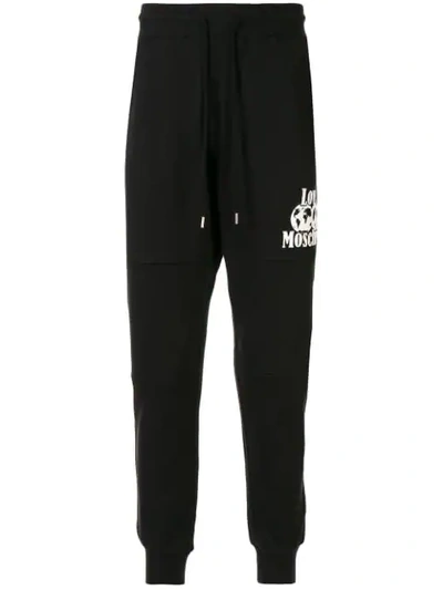 Shop Love Moschino Printed Logo Track Pants In Black