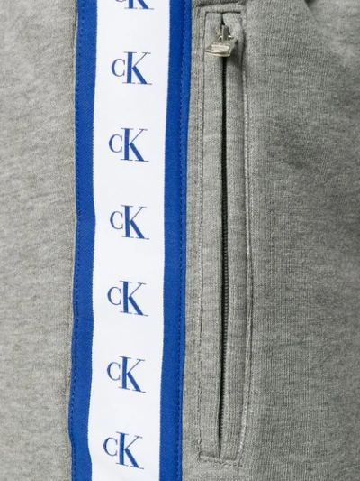 Shop Calvin Klein Jeans Est.1978 Logo Tape Track Pants In Grey