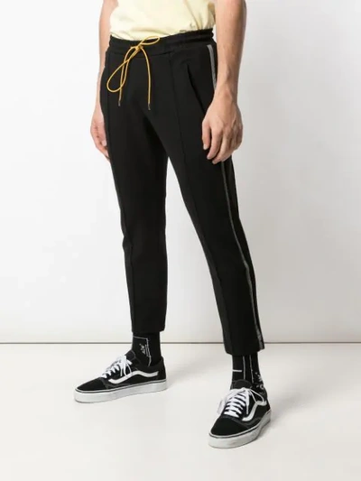 Shop Rhude Side-stripe Cropped Trousers In Black