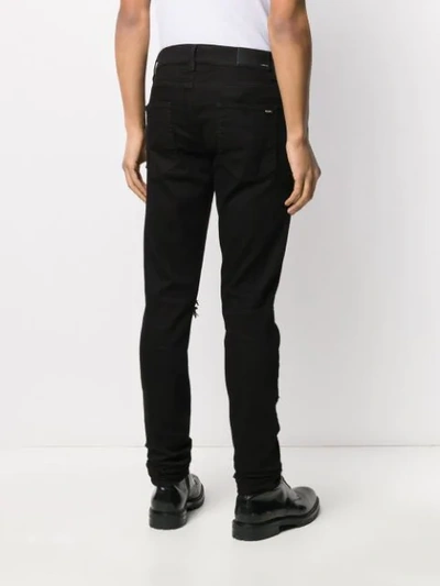 Amiri Distressed Slim Fit Jeans In Black
