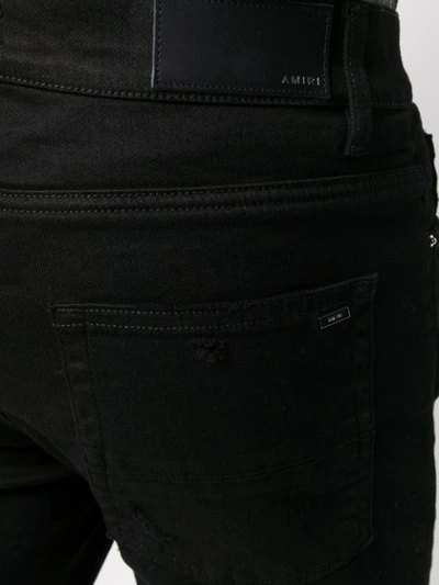 Shop Amiri Broken Ripped Jeans In Black