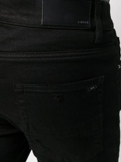 Amiri Distressed Slim Fit Jeans In Black