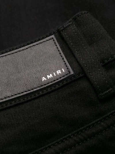 Shop Amiri Broken Ripped Jeans In Black