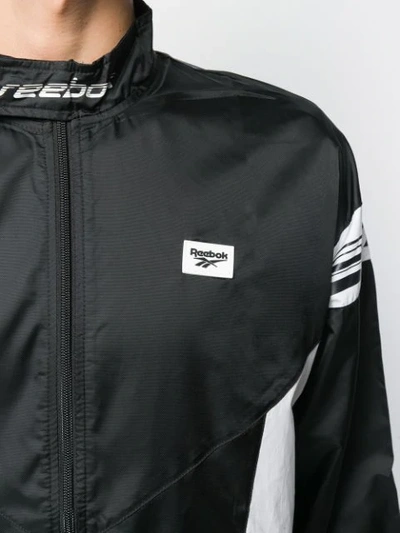 Shop Reebok Logo Strap Jacket In Black