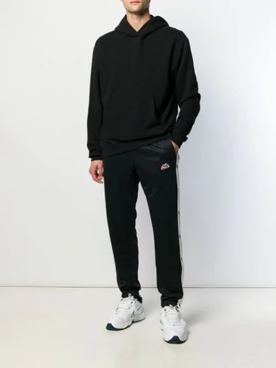 Shop Nike Logo Patch Track Pants In Black