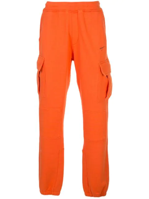white and orange track pants