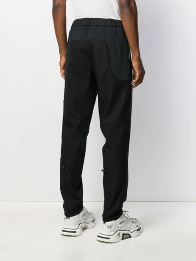 Shop Moncler Pocket Detail Slim-fit Trousers In Black