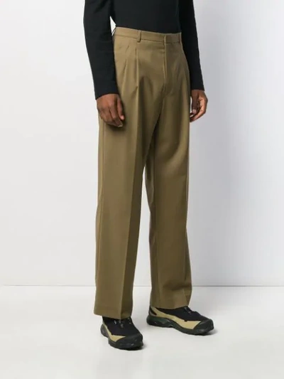 Shop Cmmn Swdn Double-pleat Trousers In Green