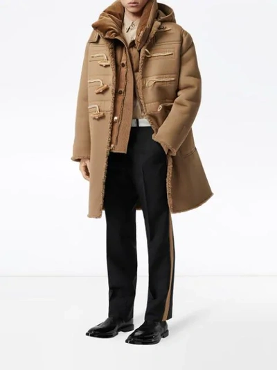 Shop Burberry Hooded Shearling Duffle Coat In Brown