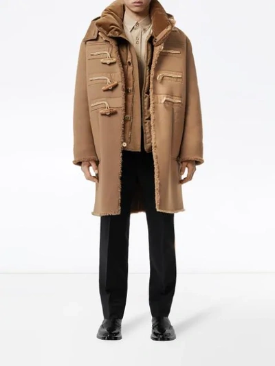 Shop Burberry Hooded Shearling Duffle Coat In Brown