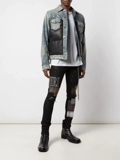 Shop Amiri Skinny Patchwork Jeans In Black