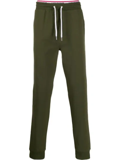 Shop Moschino Logo Tracksuit Bottoms In Green