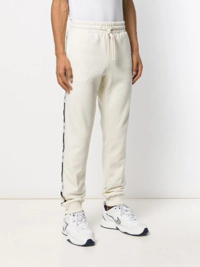 Shop Tommy Hilfiger Drawstring Track Trousers In White