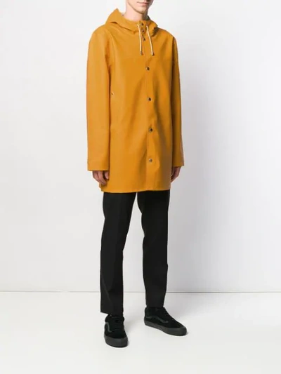 Shop Stutterheim Stockholm Hooded Raincoat In Yellow