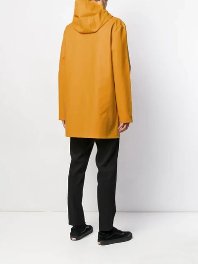 Shop Stutterheim Stockholm Hooded Raincoat In Yellow