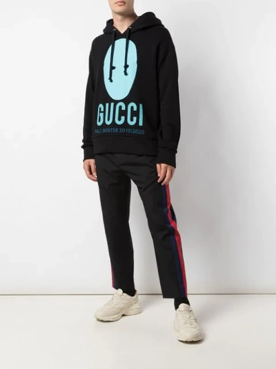Shop Gucci Manifesto Printed Hoodie In Black