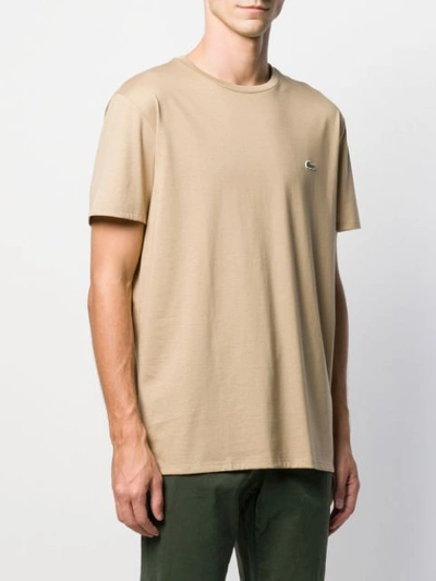 Shop Lacoste Logo Embroidered T-shirt In Neutrals