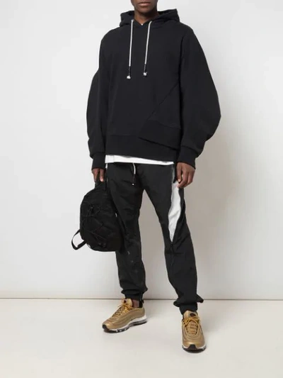 Shop Mostly Heard Rarely Seen Staggered Hem Hoodie In Black