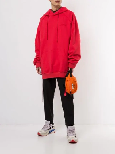 Shop Juunj Embroidered Logo Hoodie In Red