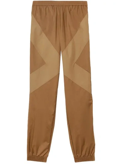 Shop Burberry Two-tone Nylon Trackpants In Brown