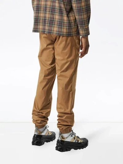 Shop Burberry Two-tone Nylon Trackpants In Brown