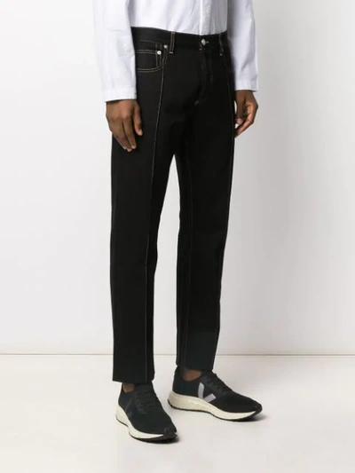 Shop Alexander Mcqueen Piped Seams Straight-leg Jeans In Black