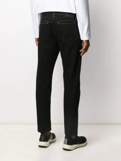 Shop Alexander Mcqueen Piped Seams Straight-leg Jeans In Black