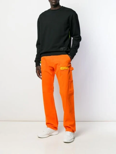 Shop Versace Wide-leg Long Jeans In Orange