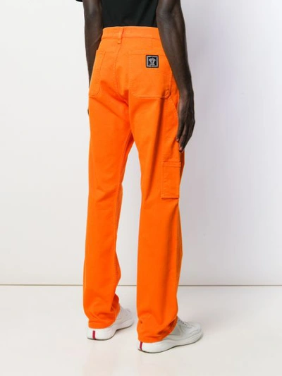 Shop Versace Wide-leg Long Jeans In Orange