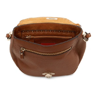 Shop Valentino Brown  Garavani Small Rockstud Saddle Bag In Hg5 Seleria