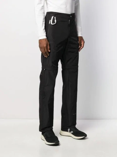 Shop Heliot Emil Zipped Knees Detail Trousers In Black