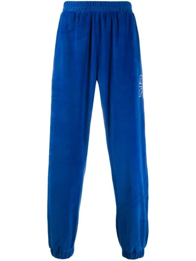 Shop Applecore Logo Embroidered Track Pants In Blue