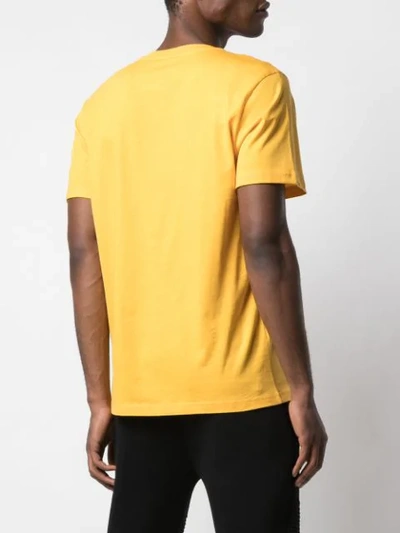 Shop Moschino Tonal Logo Print T-shirt In Yellow