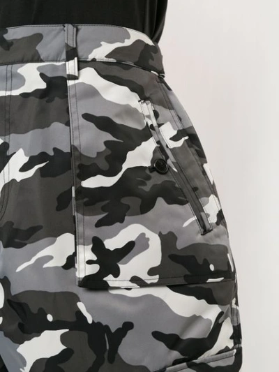Shop Juunj Camouflage Print Cargo Trousers In Multicolour