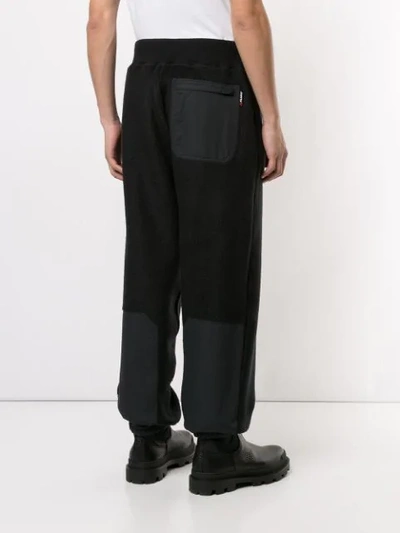 Shop Undercover Oversized Track Trousers In Black