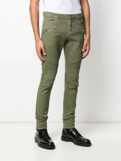 Shop Balmain Zipped Skinny Biker Jeans In Green