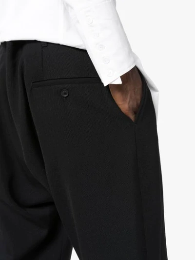 Shop Yohji Yamamoto Drop Crotch Cropped Trousers In Black