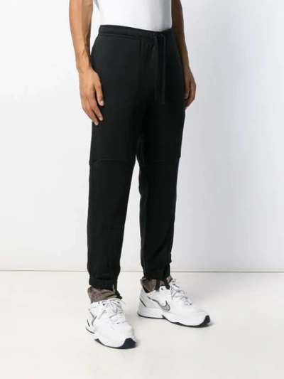 X NIKE TAPERED TRACK PANTS