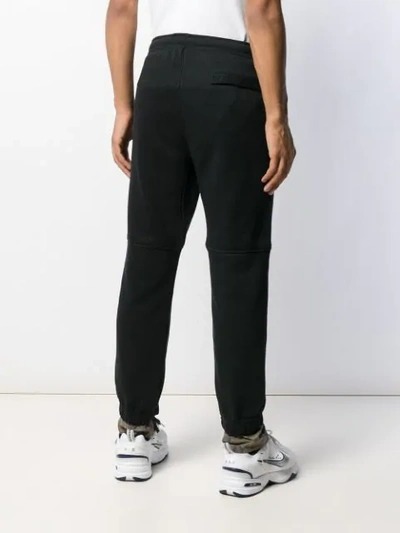 X NIKE TAPERED TRACK PANTS