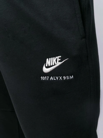 X NIKE TAPERED TRACK PANTS