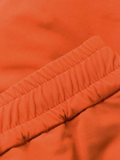 Shop Undercover Elasticated Ufo Print Track Pants In Orange