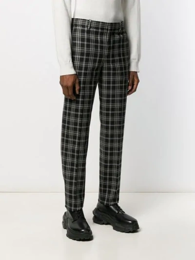 Shop Neil Barrett Tapered Check Trousers In Black