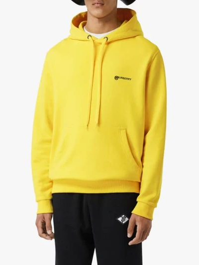 Shop Burberry Logo Print Cotton Hoodie In Yellow