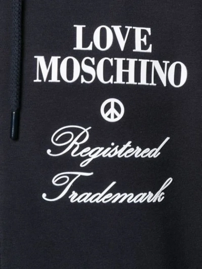 Shop Love Moschino Logo Print Zipped Hoodie In Blue
