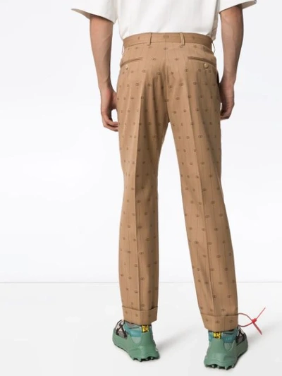 Shop Gucci Logo-print Trousers In Brown