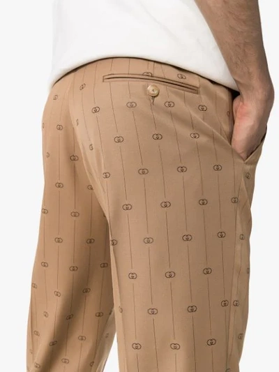 Shop Gucci Logo-print Trousers In Brown