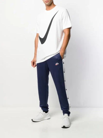Shop Nike Tearaway Popper Trackpants In Blue