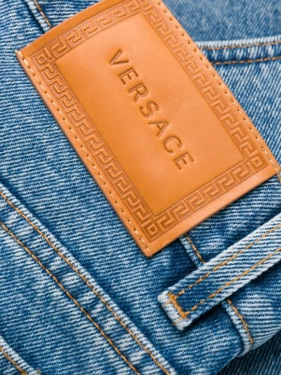 Shop Versace Embroidered Logo Straight Jeans In Blue