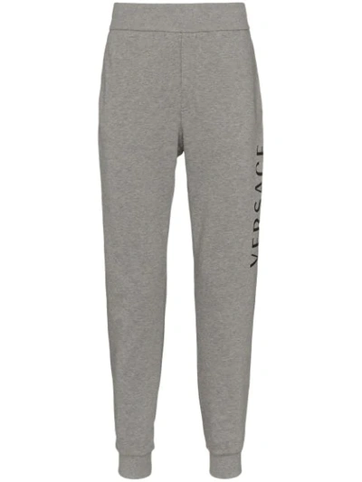 Shop Versace Logo Print Track Trousers - Grey
