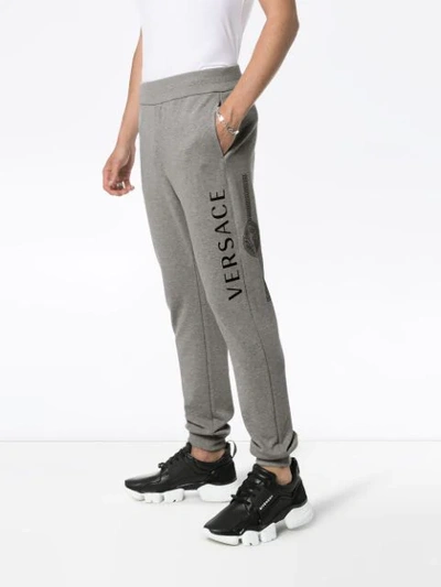 Shop Versace Logo Print Track Trousers - Grey